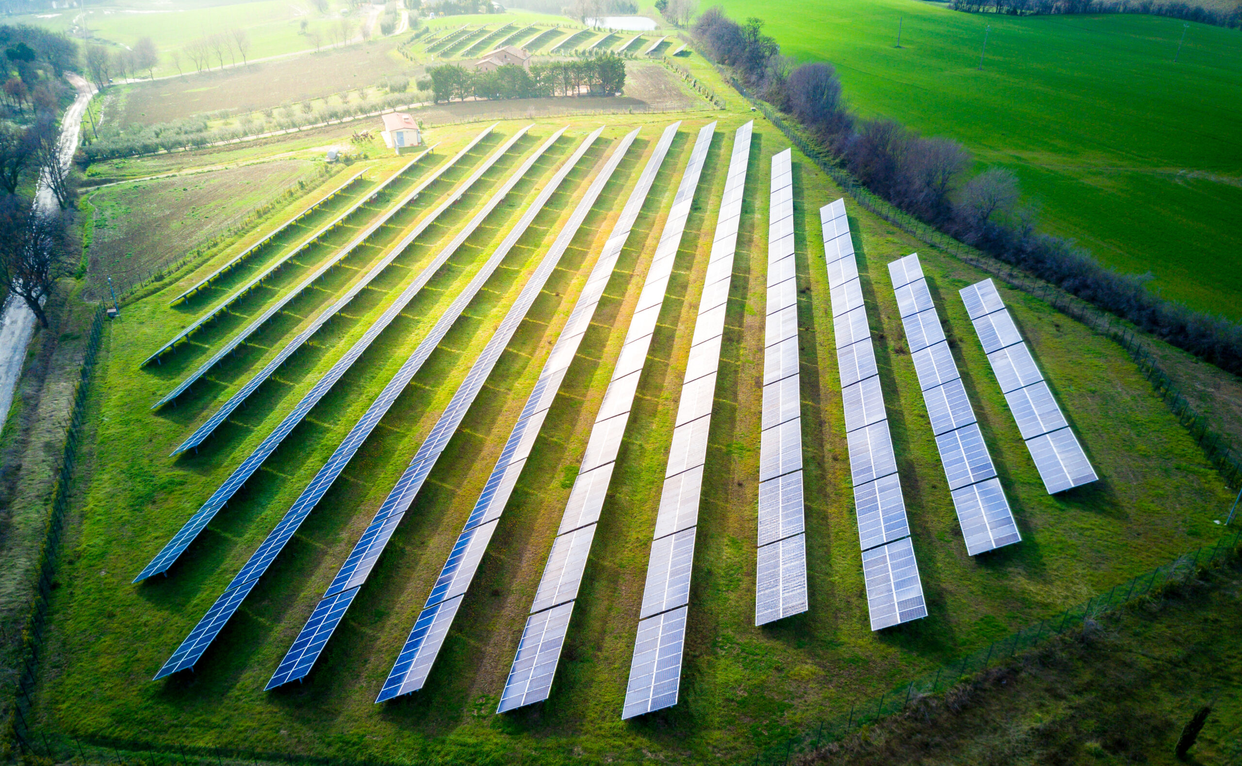 aerial view of solar panels on a sunny day. power farm producing